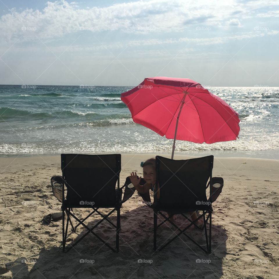 Two chairs and umbrella on the beach