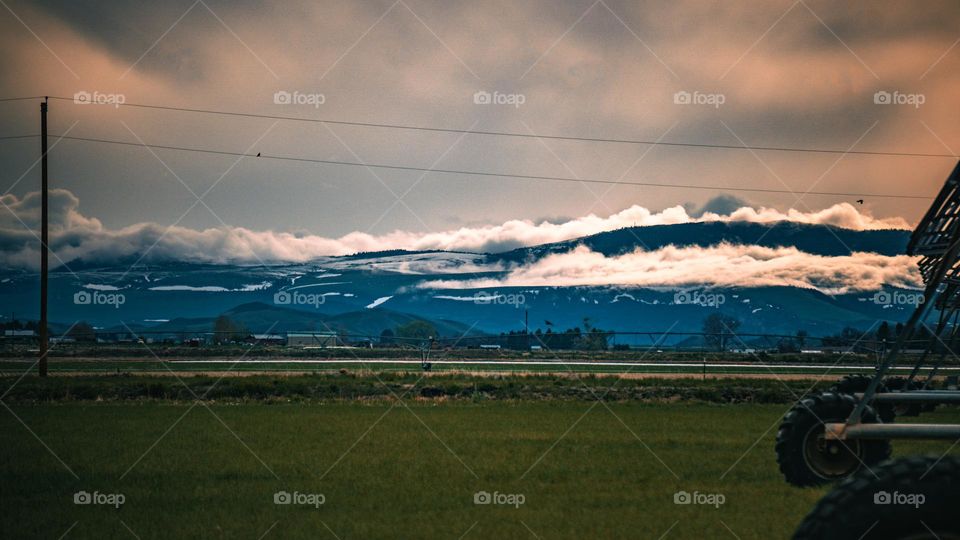 Heart mountain side covered by clouds