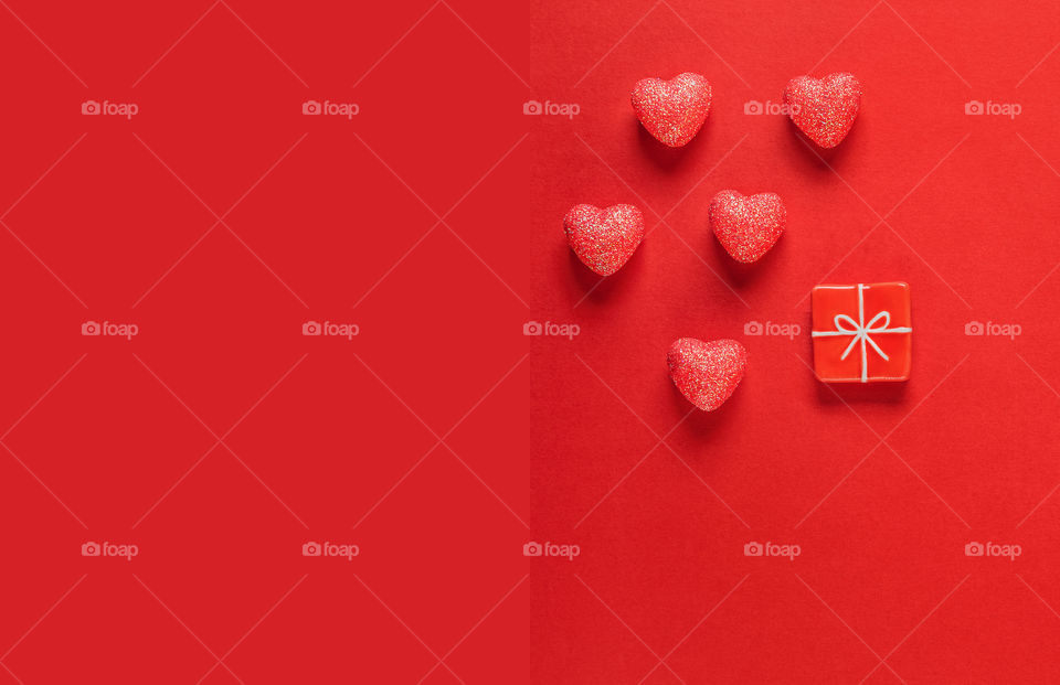 Postcard. Red hearts on a red background. Valentine's Day.