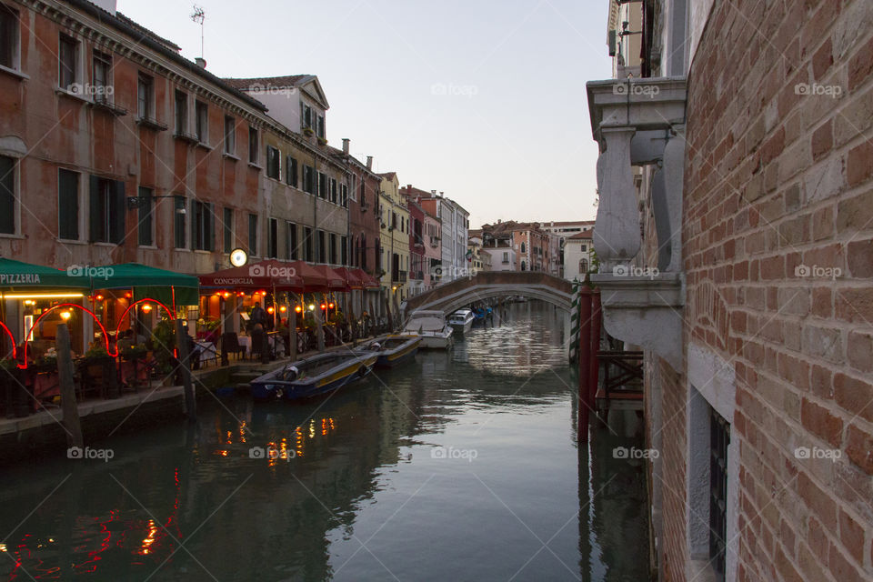 Dinner on a terrace at a canal in Venice. 