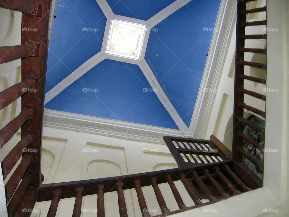 Into Blue. Peruvian style architectural features, wood railing and blue ceiling