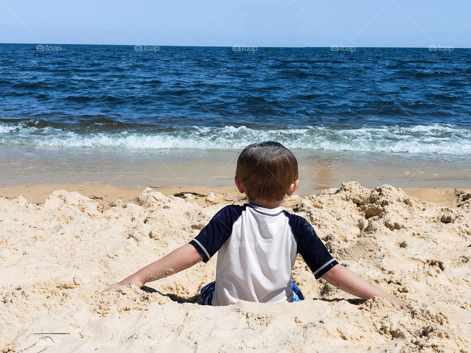 child playing on the beach