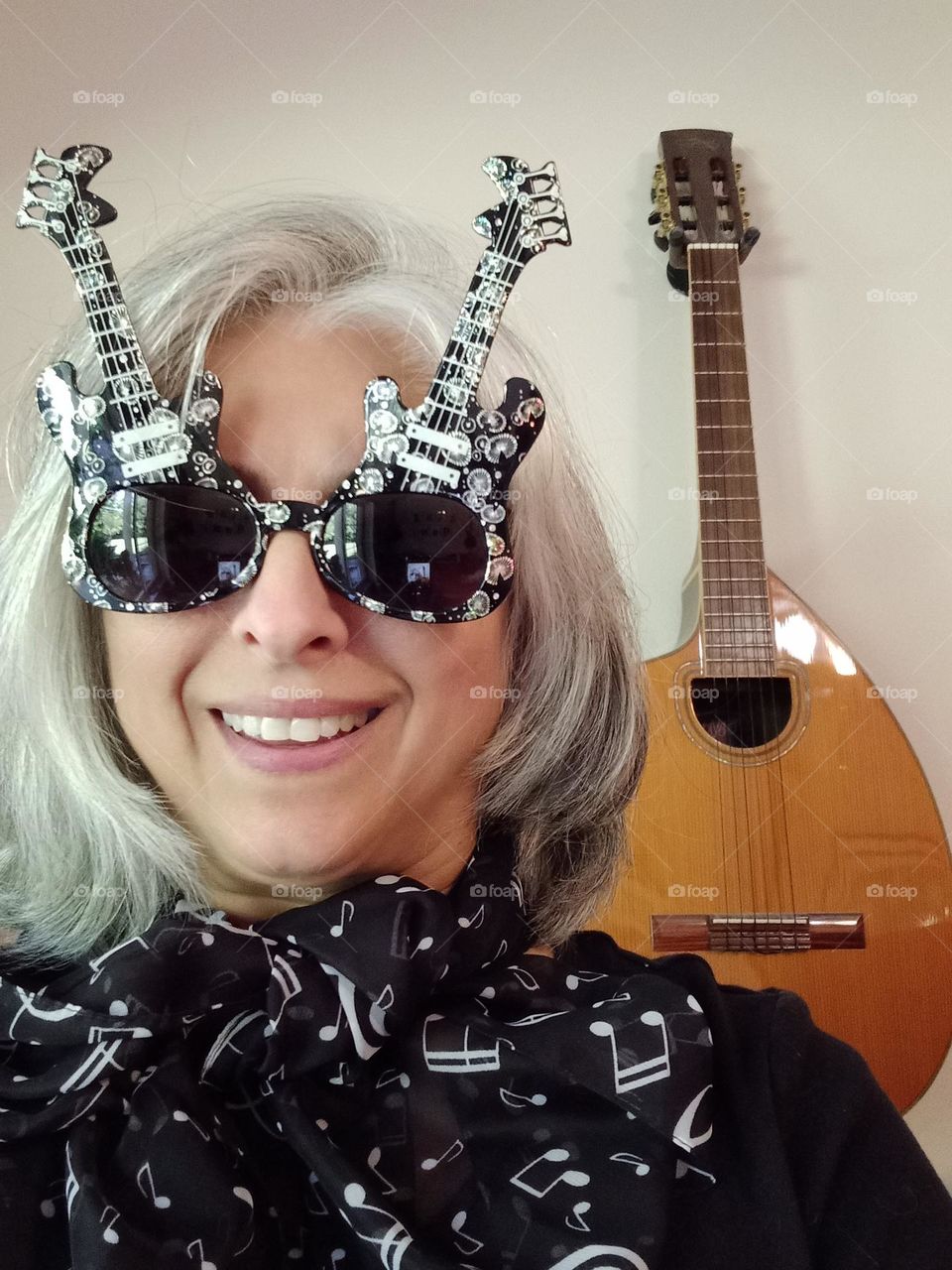 Ready to rock with  guitar sunglasses on and my beautiful Craviola guitar in background