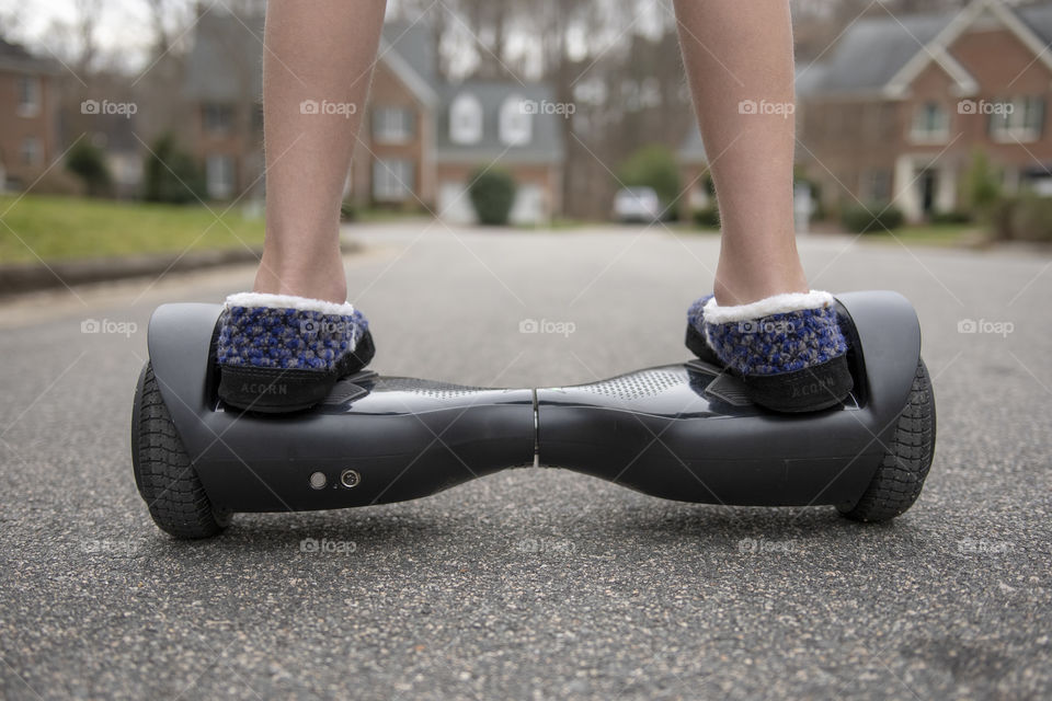 Boy on a Hoverboard in the neighborhood 