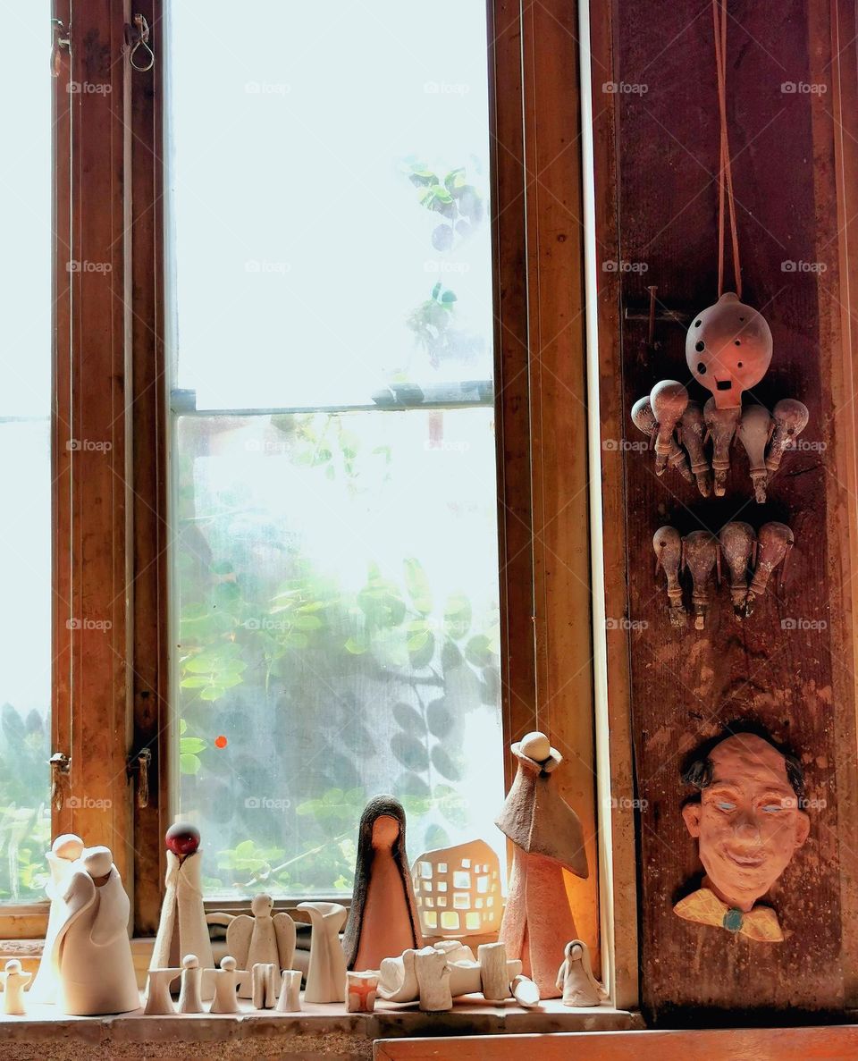 Clay figures in old window