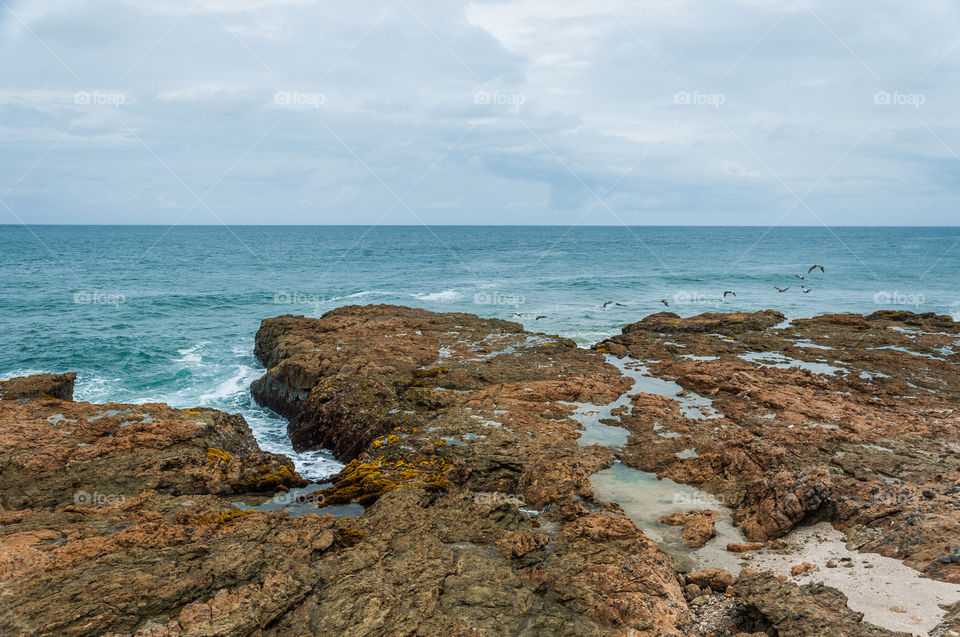 Rocky seashore and blue ocean 