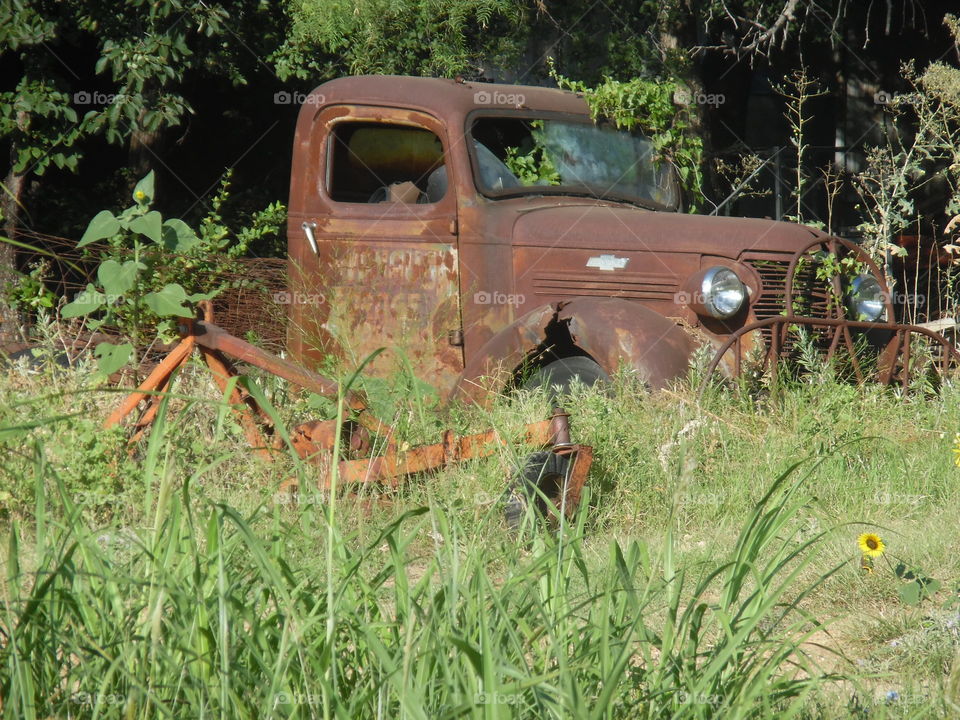 still runs, in great shape. This is a picture of a beautiful old vintage truck parked out in the country