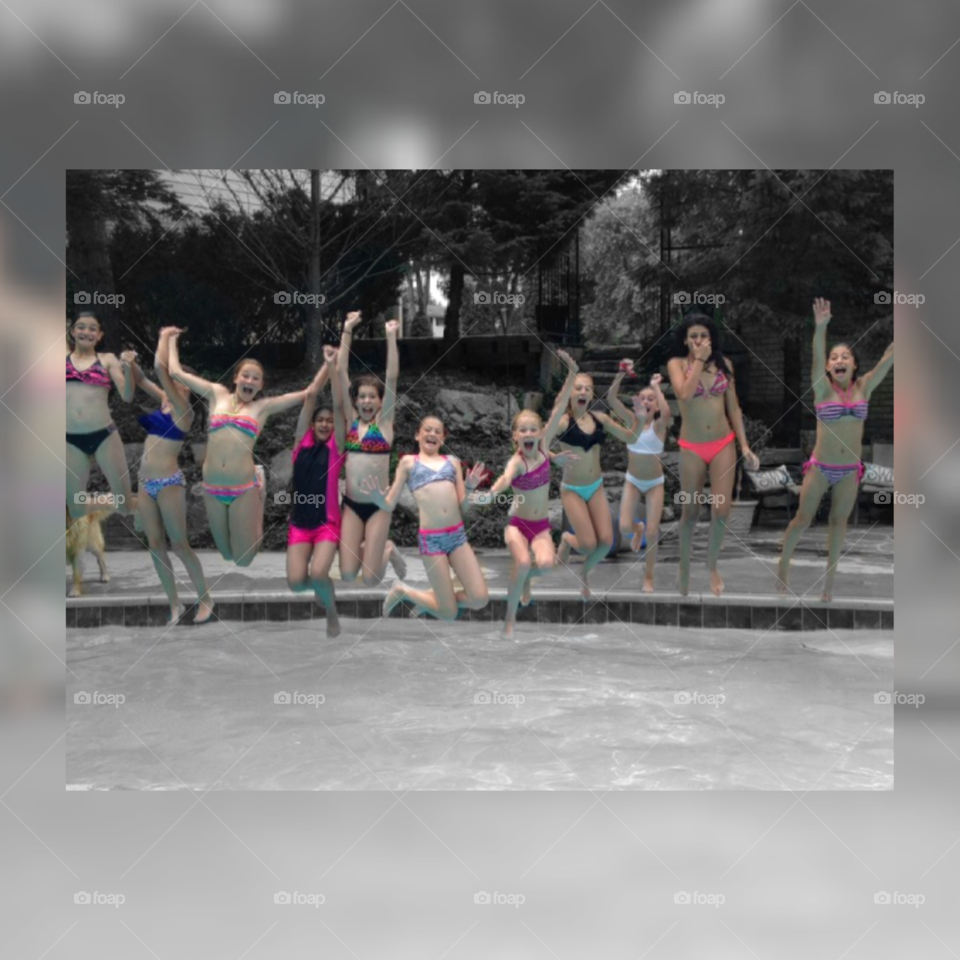 Team dive in . This is a photo of my soccer team jumping in a pool at the end of the year party
