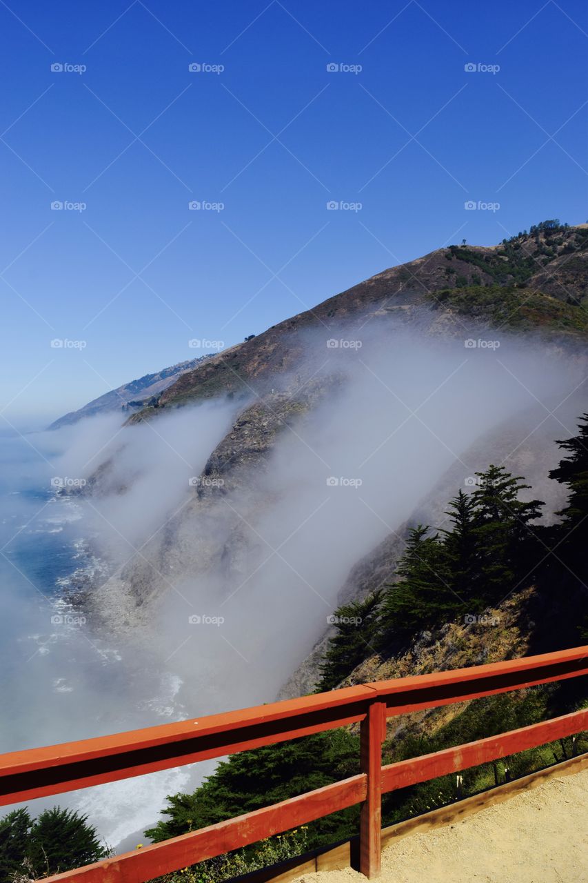A car stop on highway one with a beautiful view