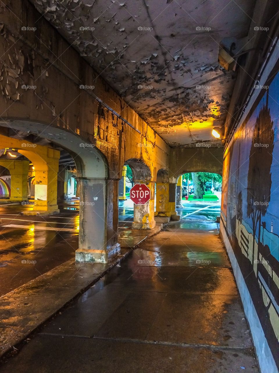 Stop sign under the subway