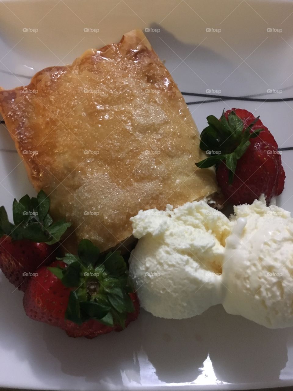 Apple tart, strawberries and ice cream