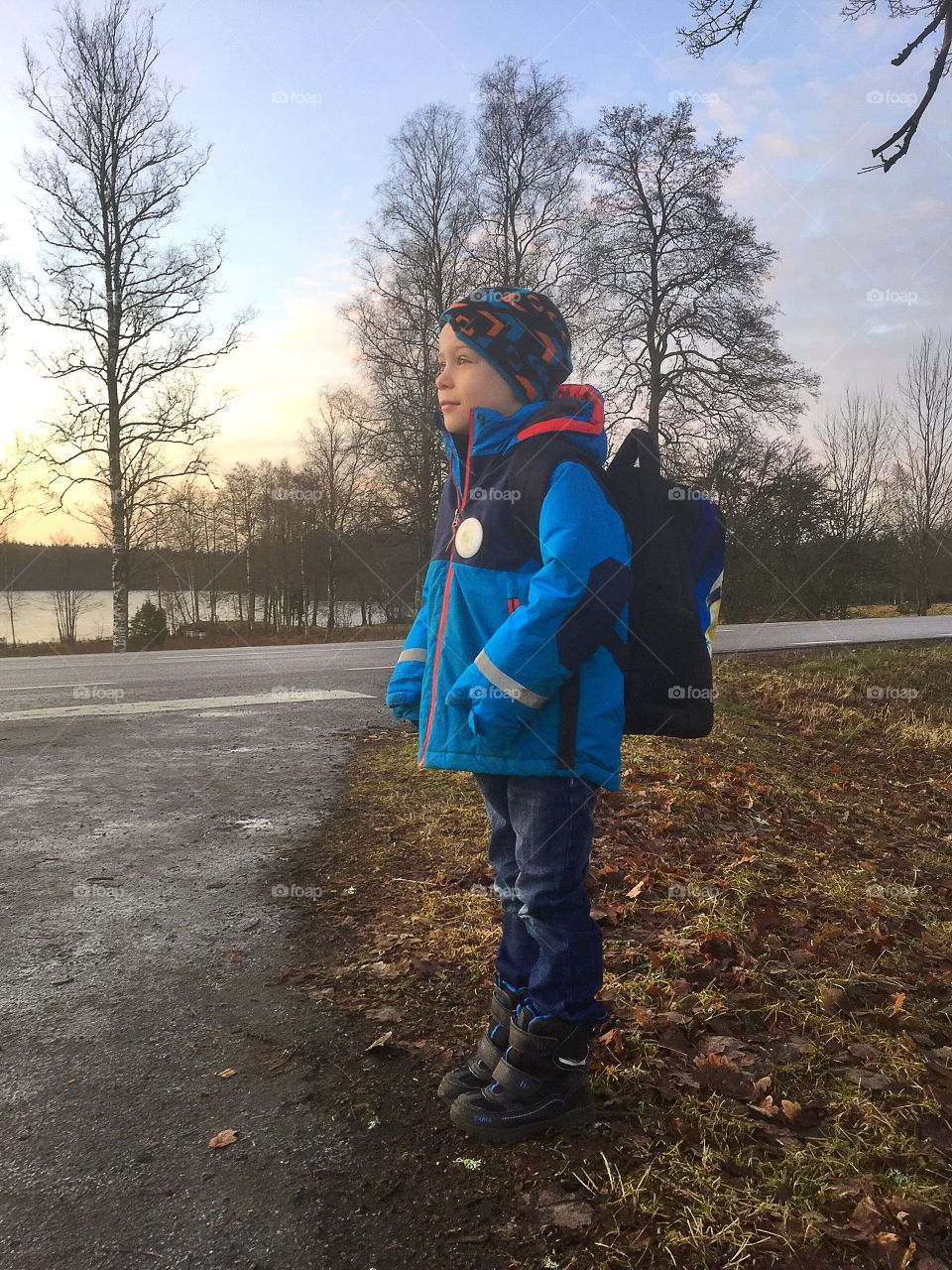 Boy waiting for the schoolbus