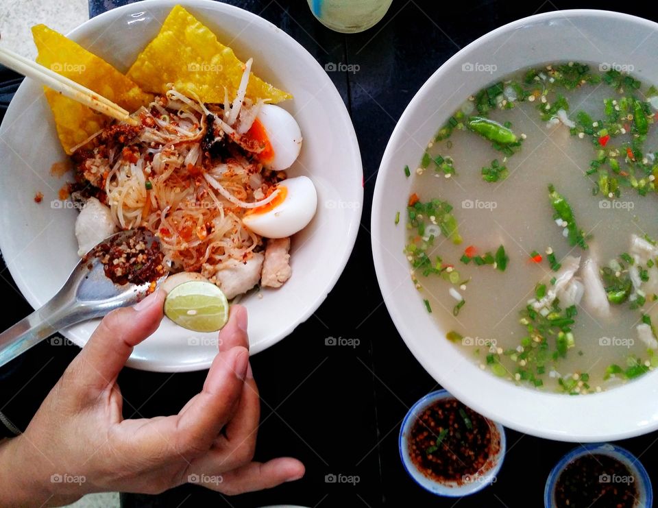 High angle view of Tom Yum soup and noodle