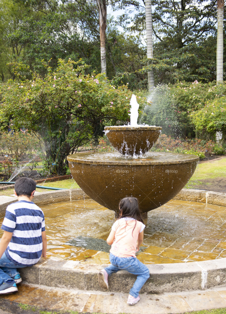 Children playing in fountain 