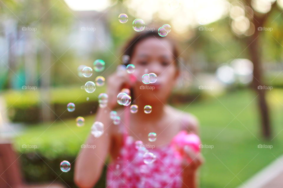Kid playing bubble 