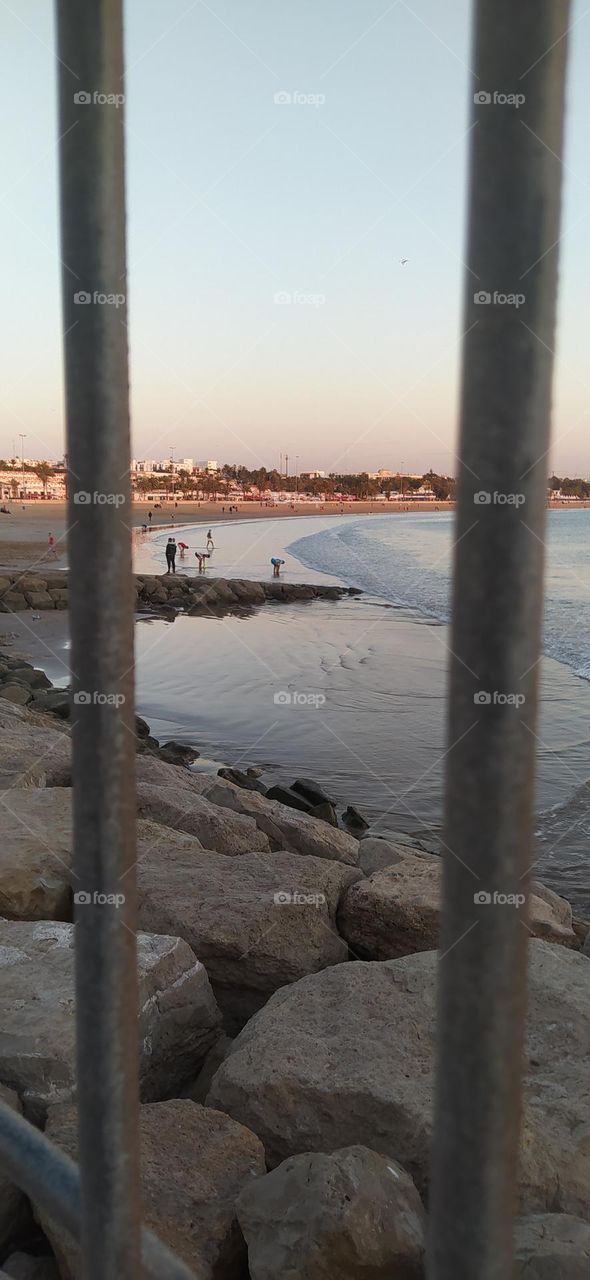 the players after the football in the beach
