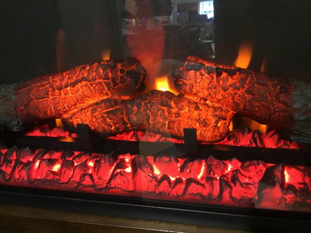 FIRE WOOD BURNING IN FIRE PLACE 
