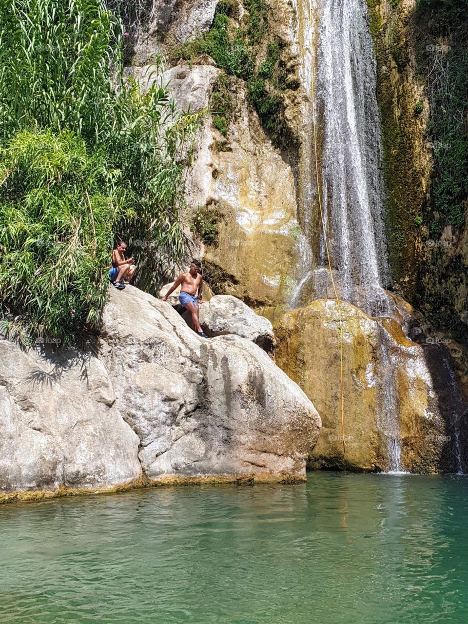 Waterfall#rocks#lake#humans