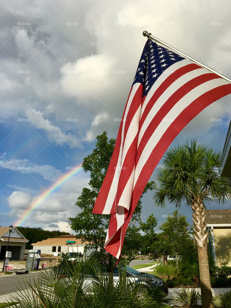 Rainbow with American Flag in Wesley Chapel,  Fl.  taken 9/20/16 with Iphone 6s. 