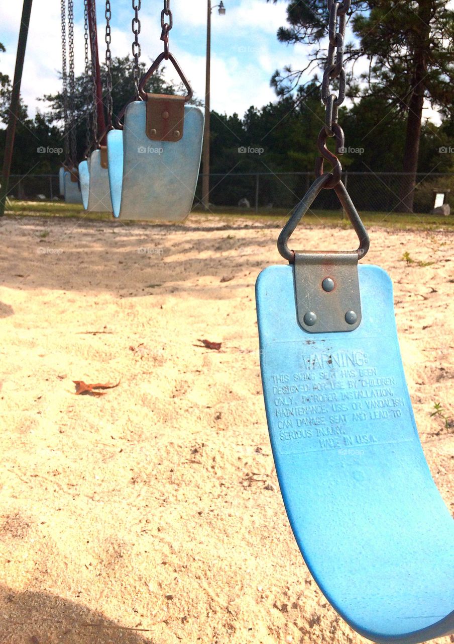 Row of empty swings 