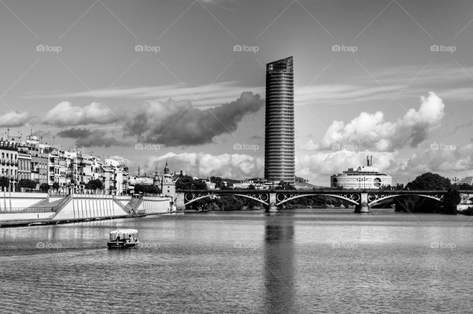 Cajasol Tower. View of Triana Bridge, Cajasol Tower and the Maritime Museum, Sevilla, Spain.