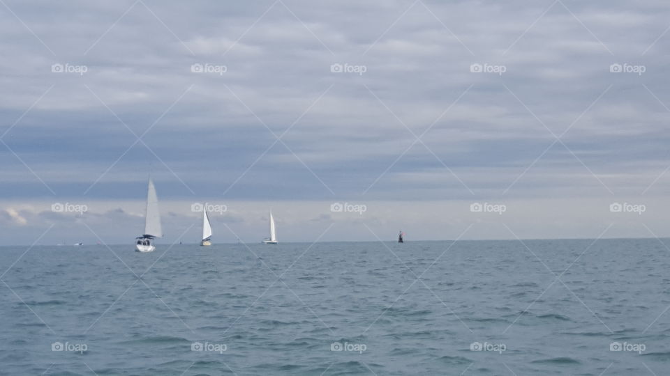 Sailboats on the horizon