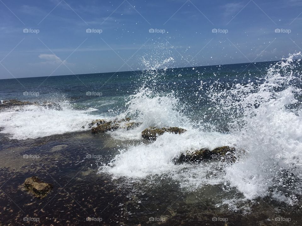 Waves hitting the Rocks