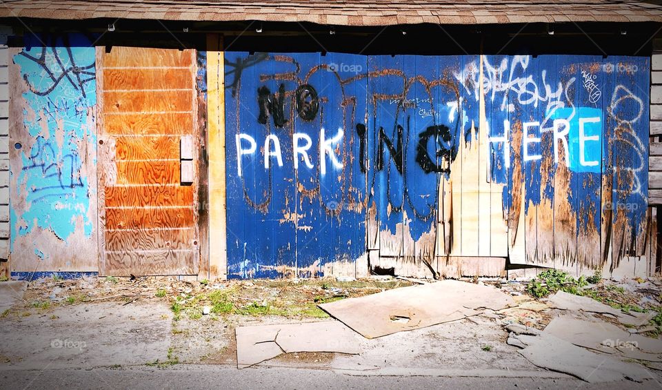 No parking spray painted on dilapidated garage in Vancouver