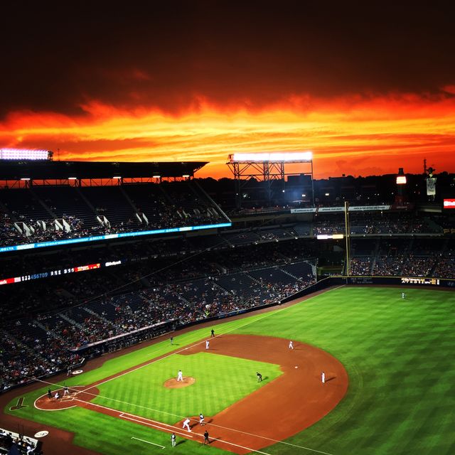 Take me out to the ball game.... Watching a baseball game with a beautiful sunset in the background. 
