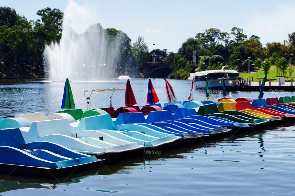 Colorful paddle boats in fountain