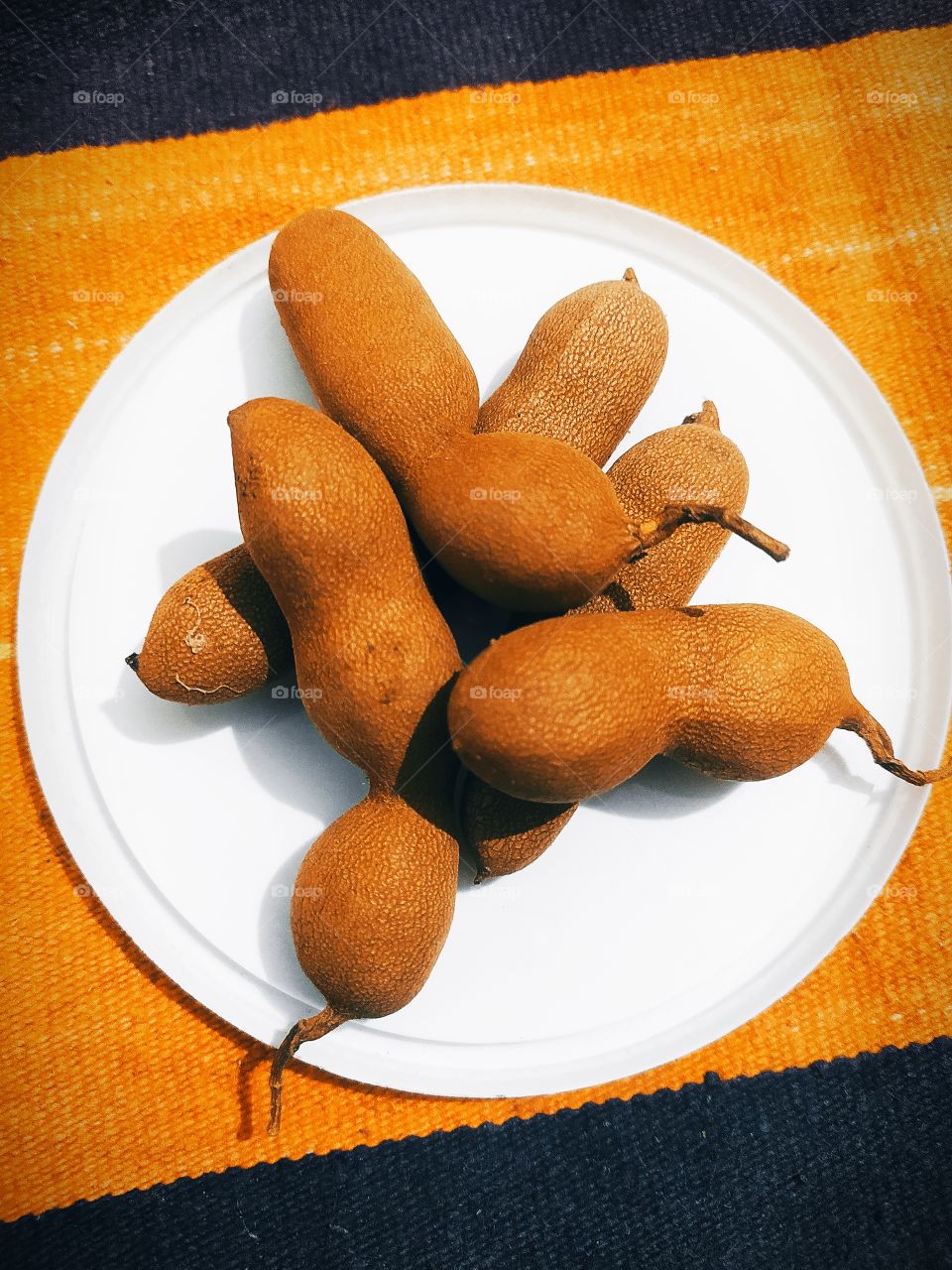 Tamarind also called pod brown colour fruits with sweet taste