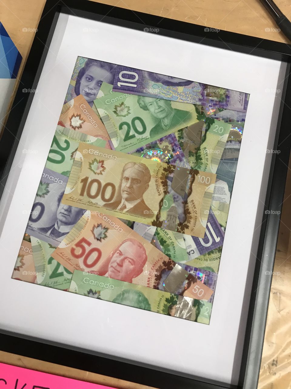 Frame full of Canadian money
