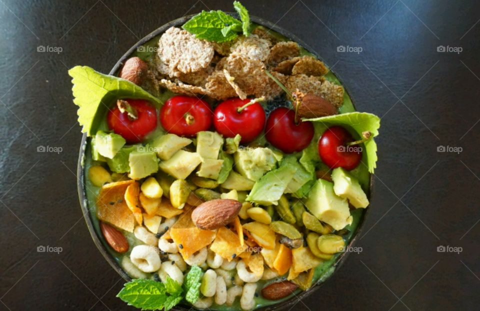 Fresh Fruit Smoothie Bowl - cheery, mango, banana, cereals,  seeds and nuts