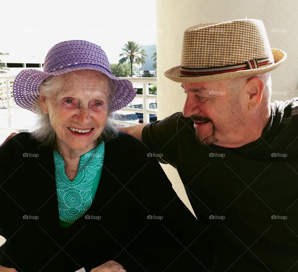 Portrait of senior mother with son smiling