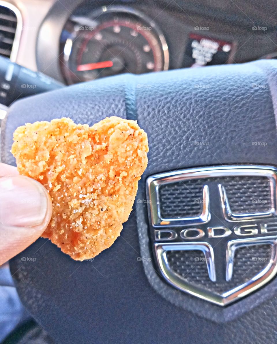 eating a heart shaped chicken tender for lunch.