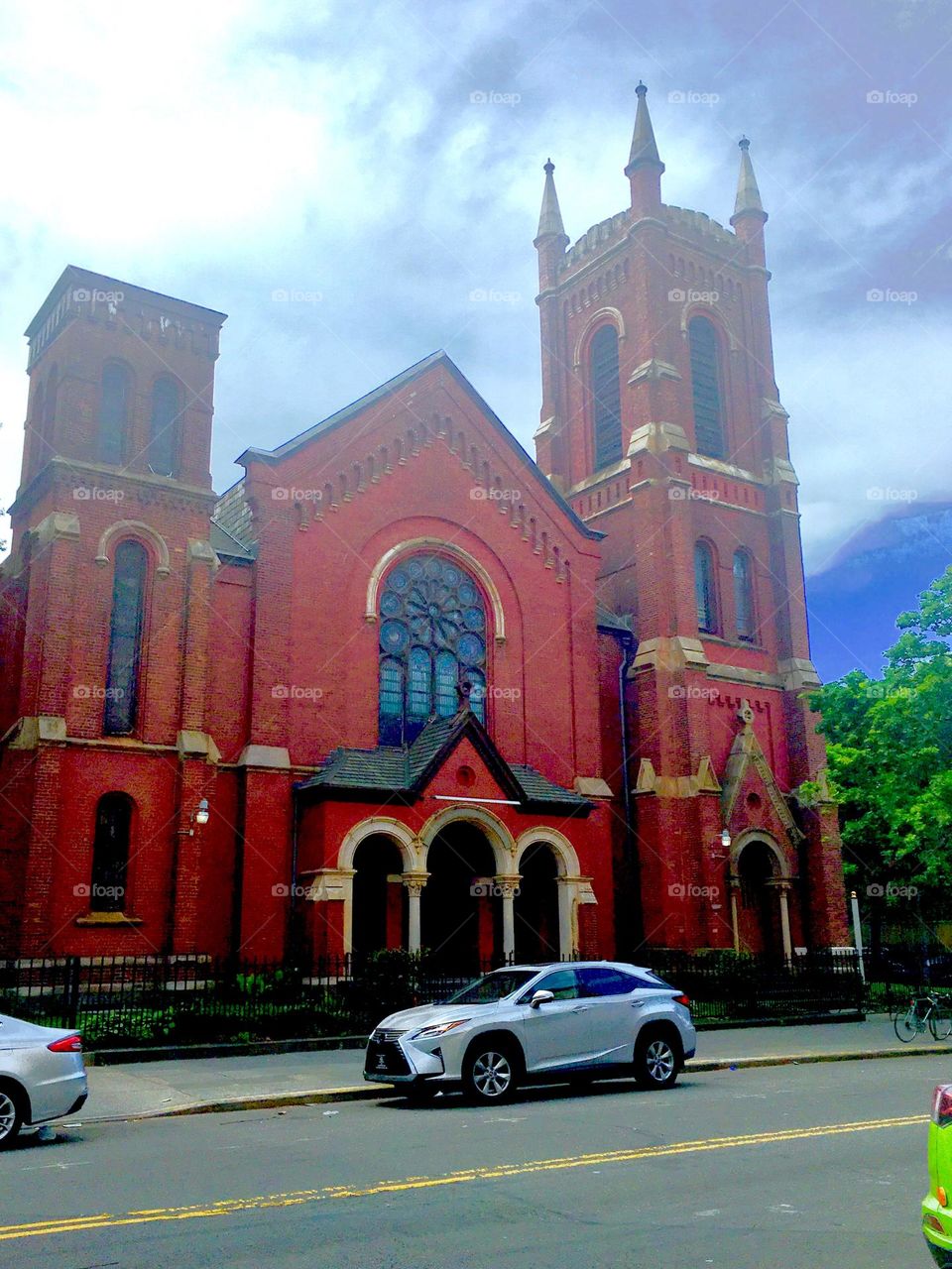 This Fort Greene, Bklyn, NY church reminds of the old fashioned styles in which many of the residential buildings around here are built w towers, steeples, stucco ornaments, arched windows and columns in the entrance. 2019. Hypnotic Productions