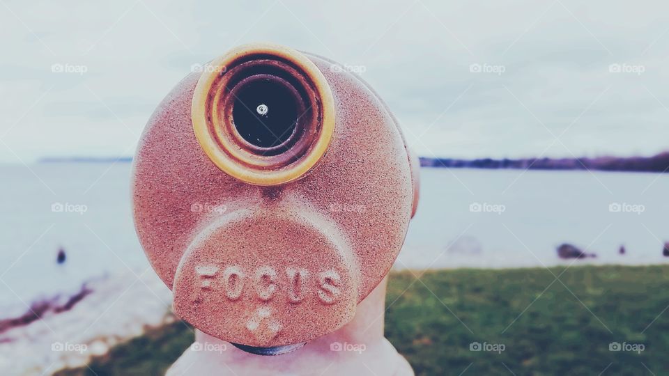 telescope overlooking water