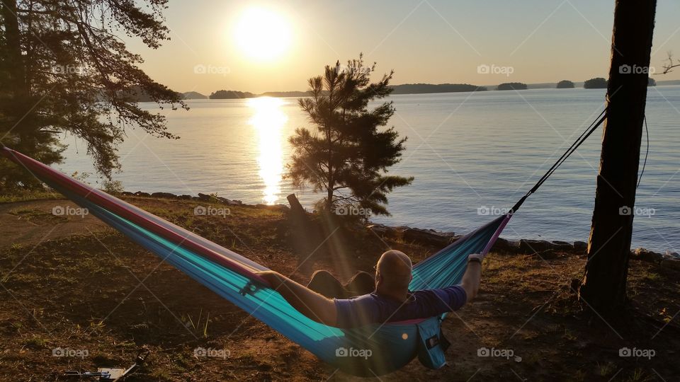 watching the sunrise over a lake in hammock