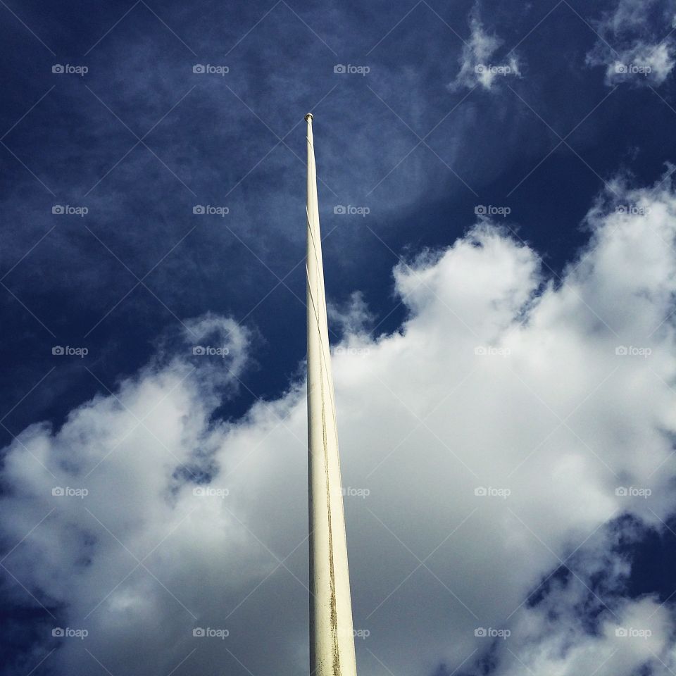 Reach for the sky. Flagpole without a flag