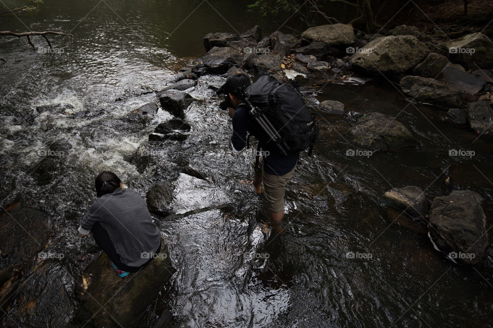 Photographer in the water field 