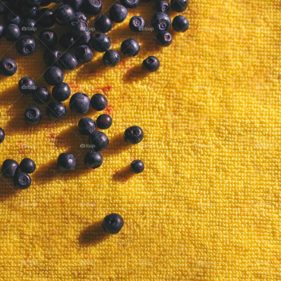 Berries on yellow background