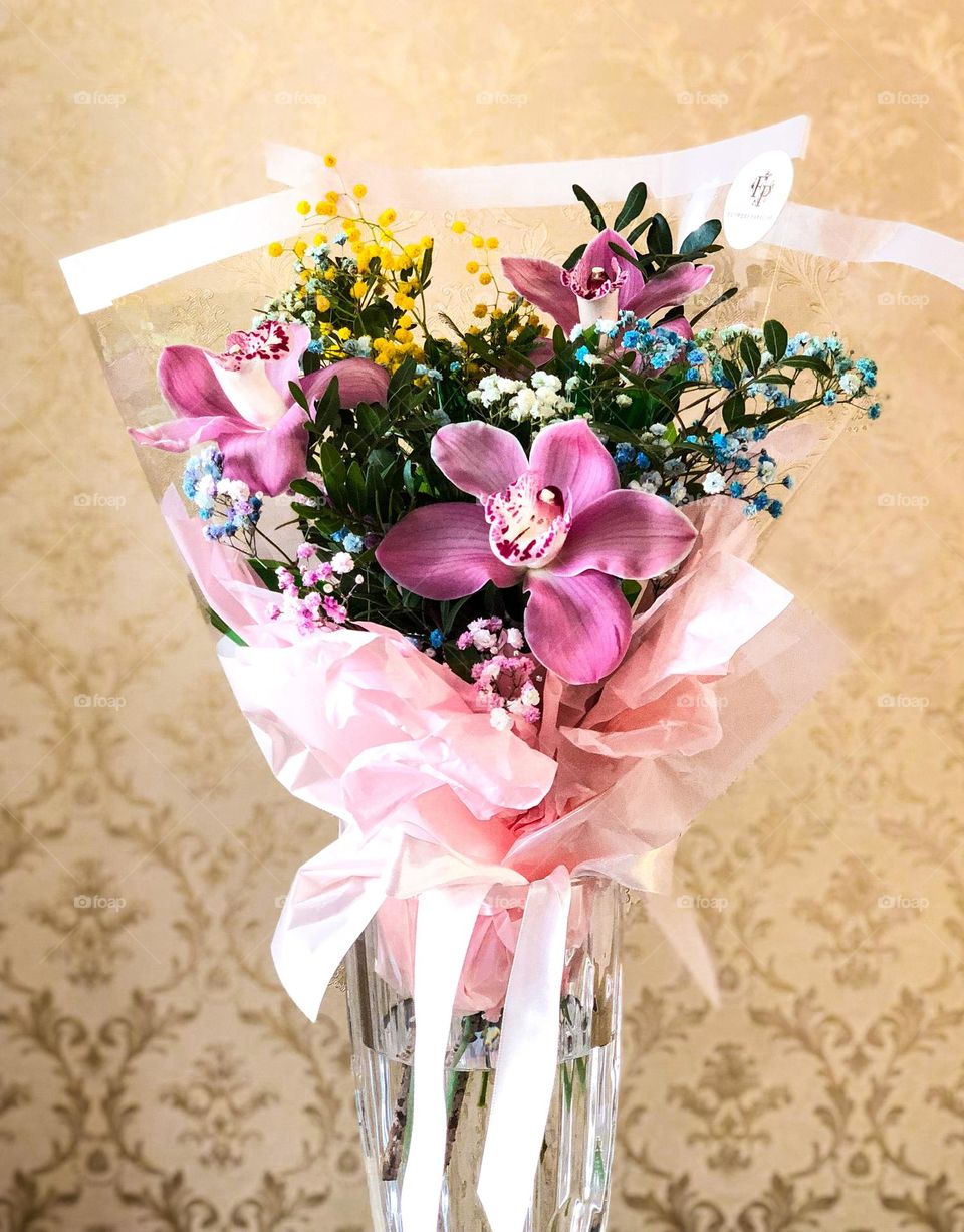 Orchids and another flowers in vase