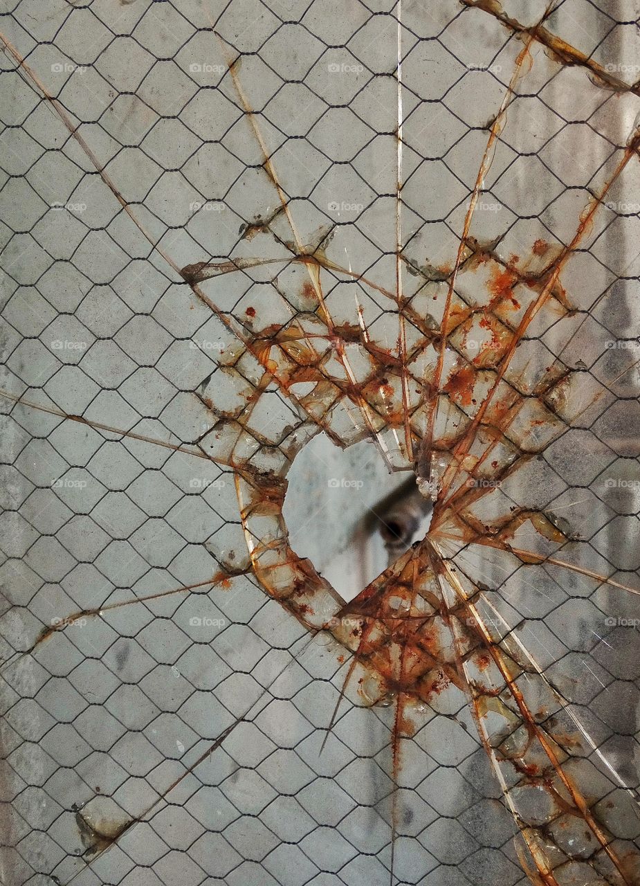 Shattered Glass. Broken Industrial Glass Window Pane
