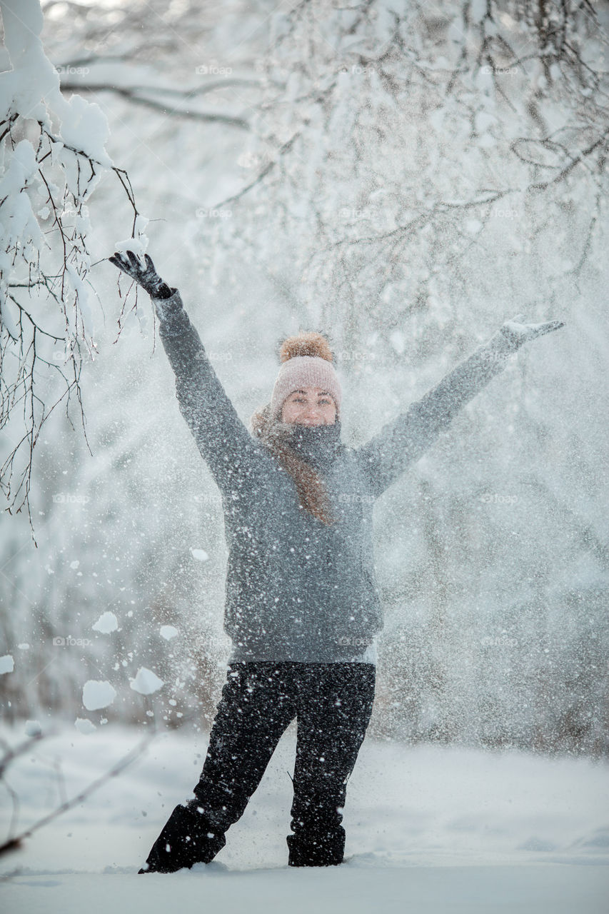 Funny girl portrait with snow