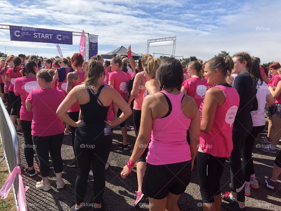A Race For Life Event put on by Cancer Research UK, runners are waiting for the starting pistol. Exeter, Devon, UK