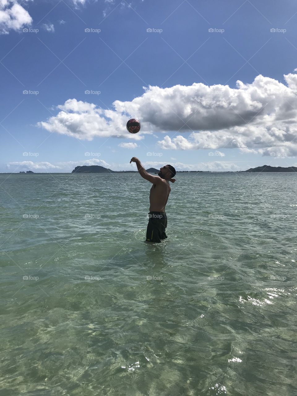 Volleyballing in the ocean 