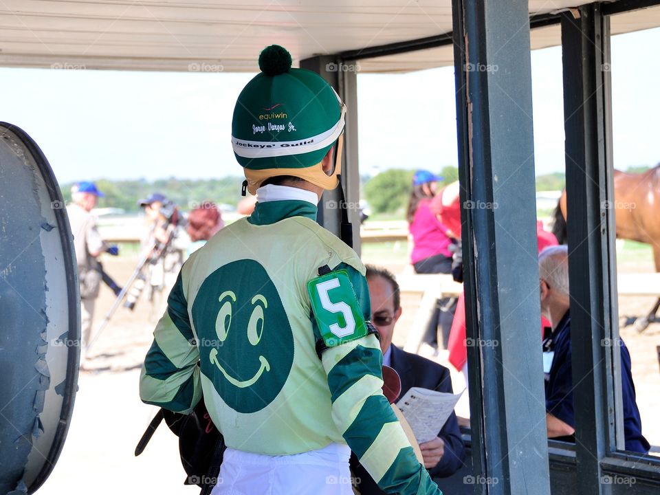 Be Happy Today. Fleetphoto at Parx Racing on Pennsylvania derby day capturing this amazing photo of Jorge Vargas and his happy face silk