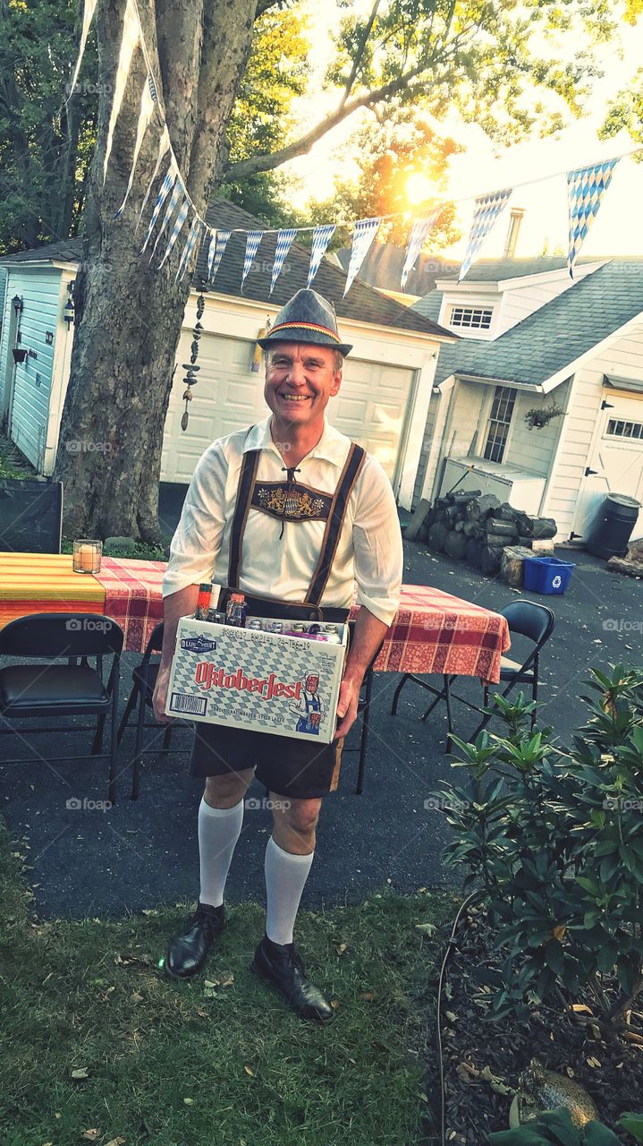 Senior man holding box of alcohol bottle