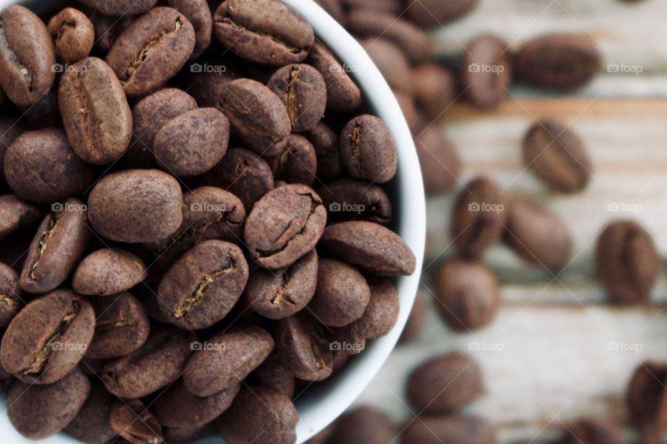 Coffee beans in a cup