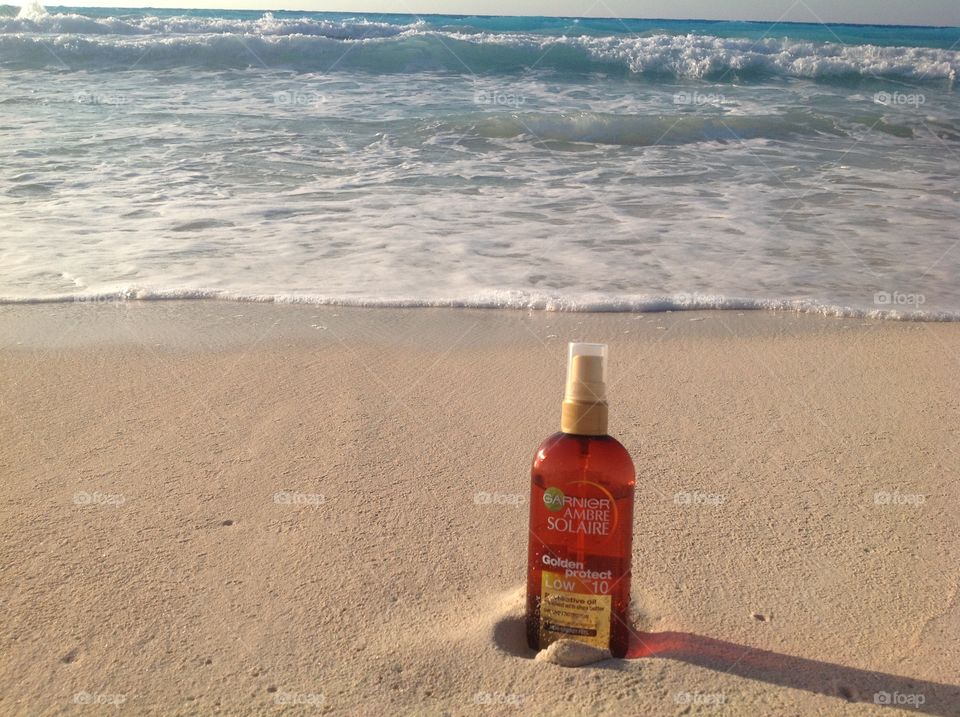 SunTan Oil Over The Beach